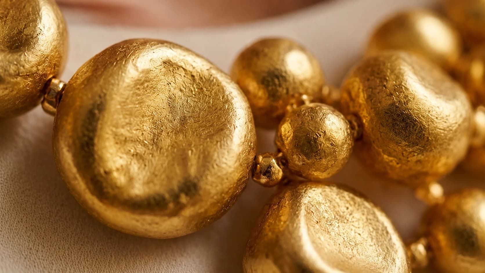 Close-up of the hammered gold nugget necklace