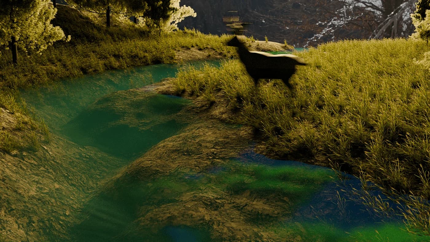 A stag standing at the river's edge in the valley