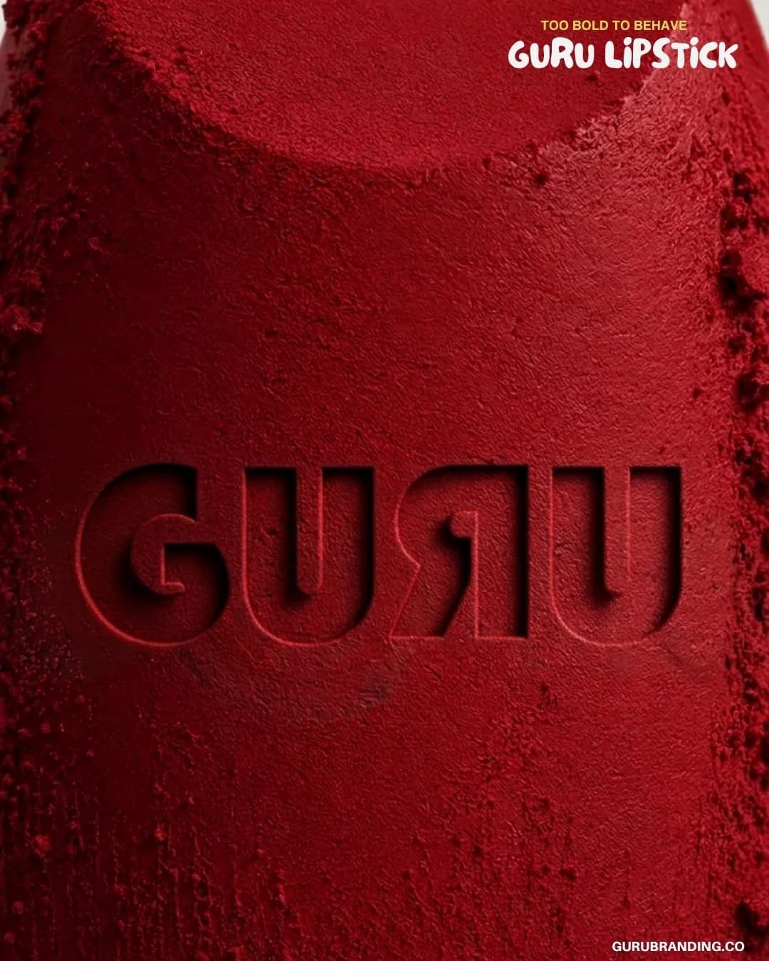 The GURU wordmark embossed into a block of red pigment