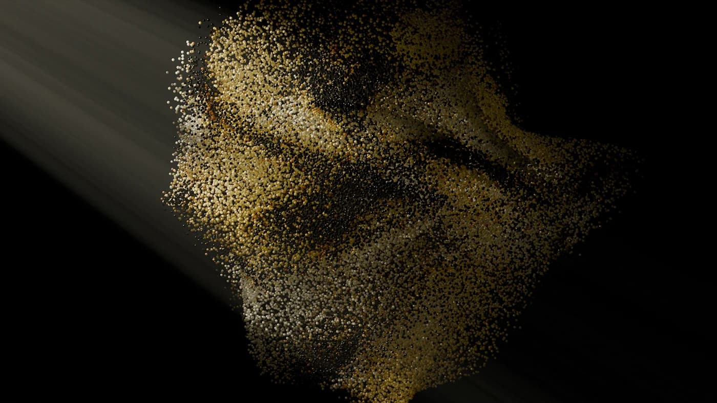 Scattered particles resolving into a form against black